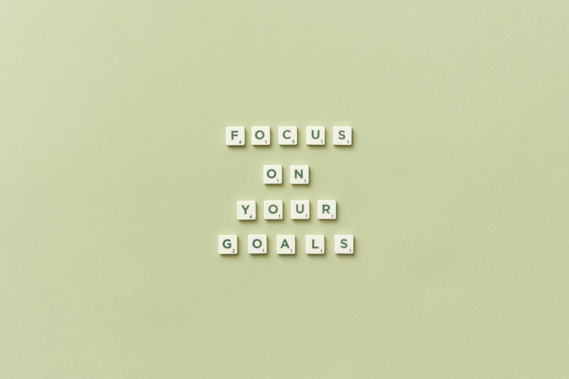 sentence focus on your goals arranged with scrabble tiles